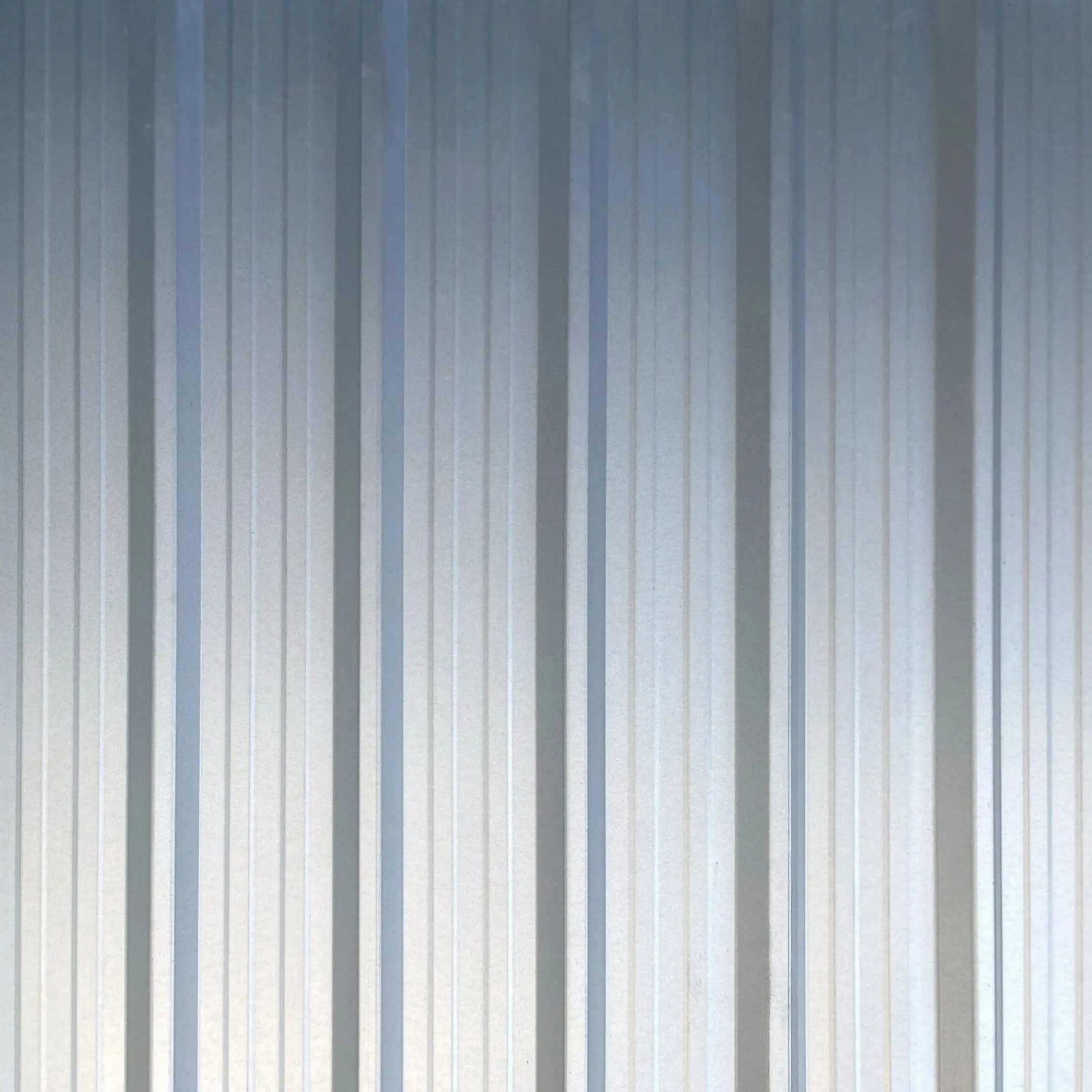 Textured vertical lines on a metallic surface.