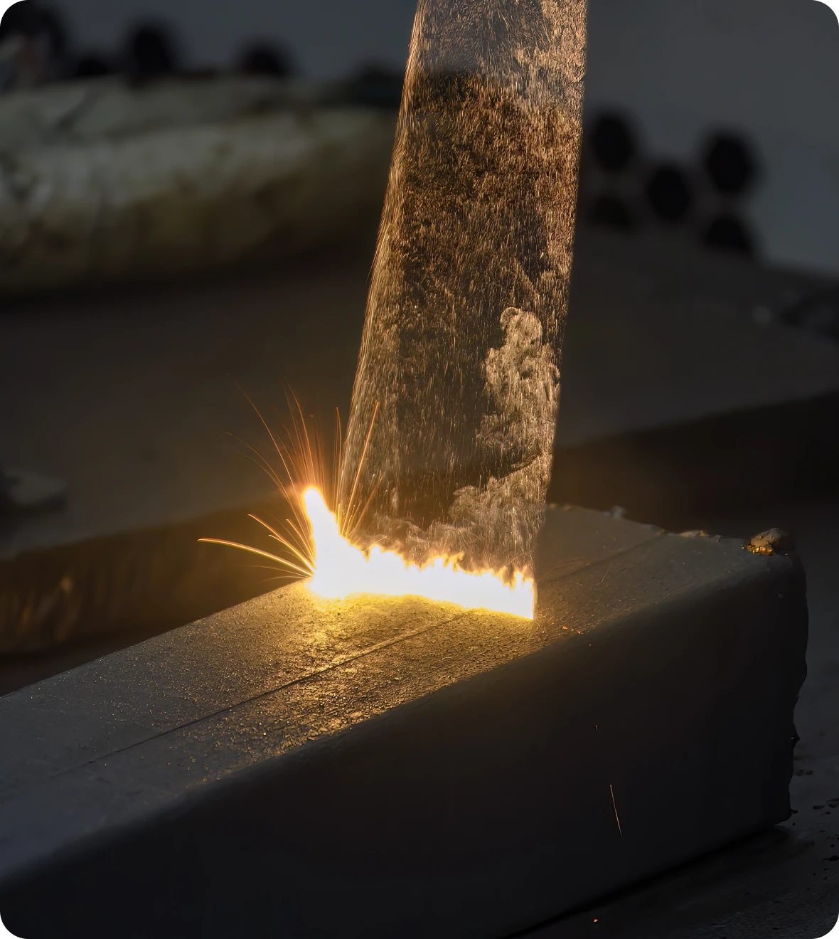 Metal cutting with bright sparks flying.