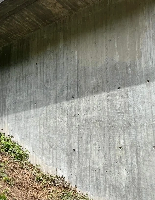 Concrete wall with sunlight and shadows.