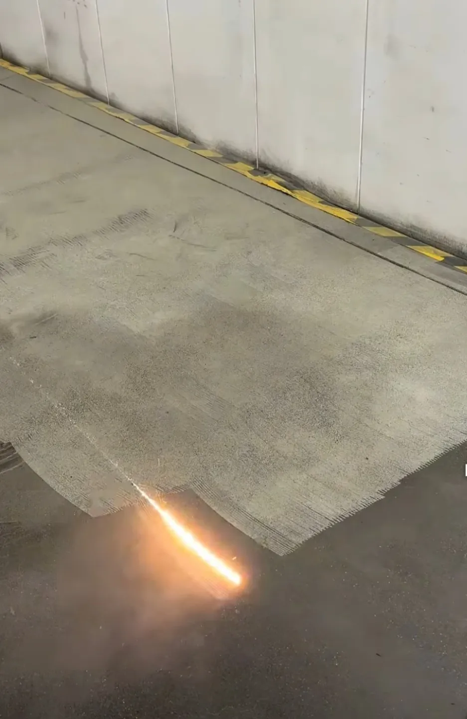Torch flame cutting industrial concrete floor